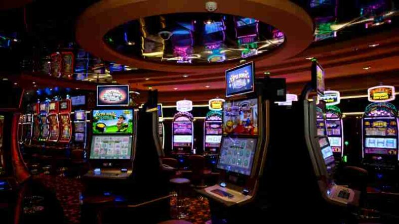 Vibrant casino floor with colorful slot machines and bright lights capturing a lively gaming atmosphere., tags: neue - pexel